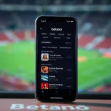 iPhone displaying Betano app interface with sports betting options in Nigerian context